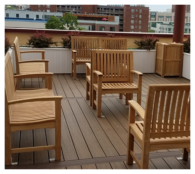 Summer Place's inviting rooftop patio features seating arranged to spark conversation, surrounded by boxed gardens.