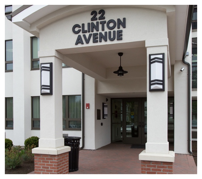 Clinton Manor's well-lit, clean covered entrance is welcoming.