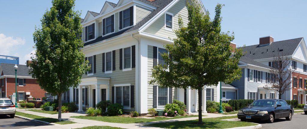 This inviting, corner building has many windows with faux shutters and covered entrances. Indented parking is available.