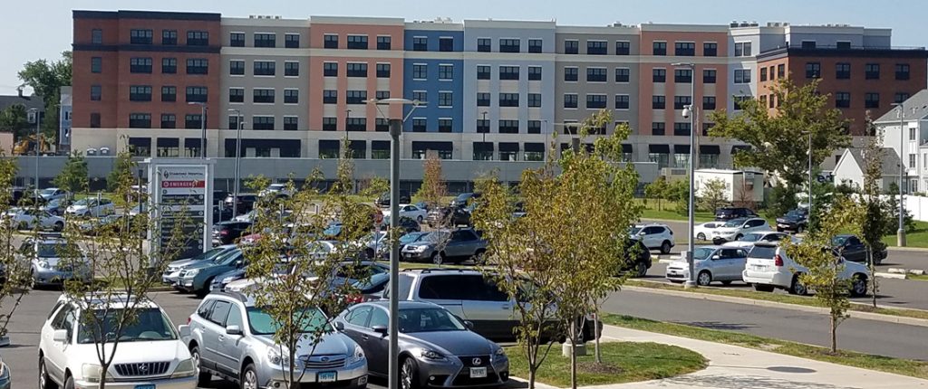 A parking lot outside of Park 215 separates visitors to the commercially-rented spaces from the residents' covered parking.