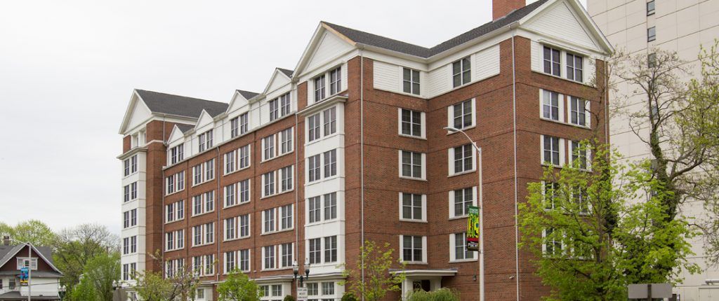 The stately, six-story Post House is wrapped in brick and has a plethora of windows with views of downtown Stamford.