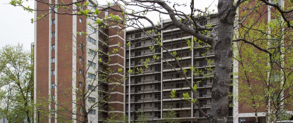 The massive eleven-story building has protected, open-air walkways on every level and plenty of windows.