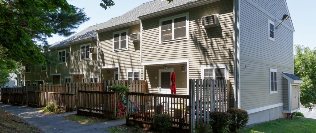 The rear entrances each have semi-private deck areas, capable of a small table and seating. In-wall AC units are visible.