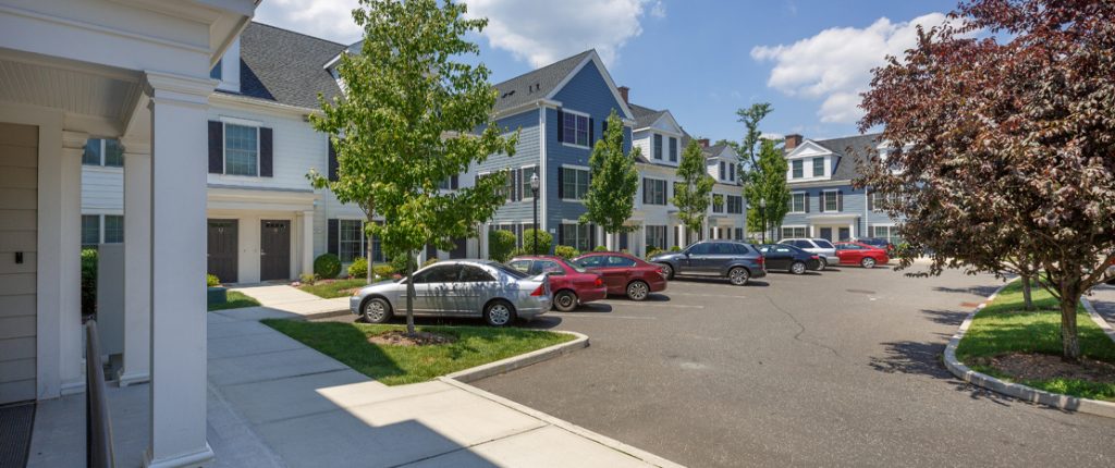 This view of the parking lot shows its safely tucked away from the main road and has many parking spaces.