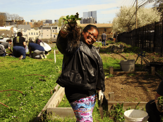 A student of one of Fairgate Farm’s educational programs enjoying the harvest.