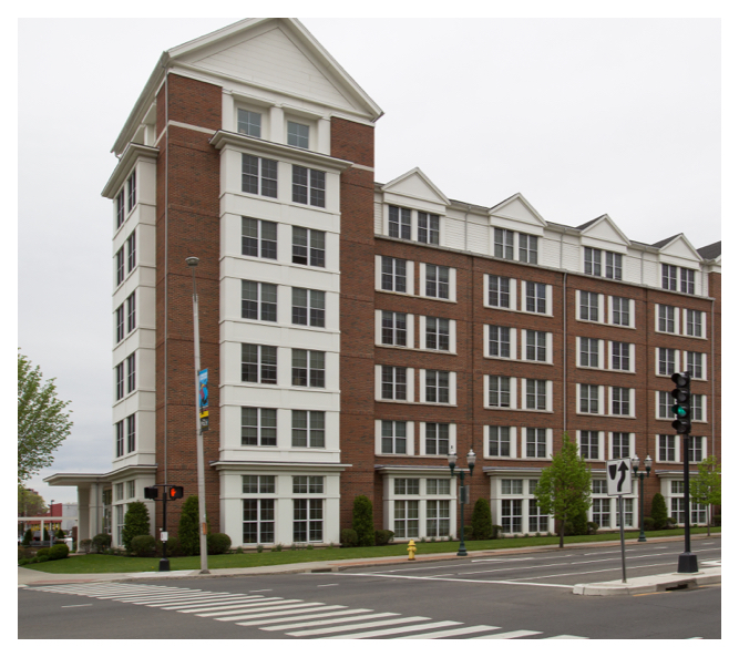 The stately Post House stands in downtown Stamford. Crosswalks with pedestrian signals make walking easier for residents.